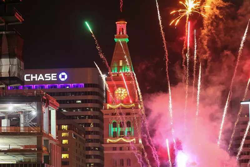 Image: Fireworks launch from a flatbed truck on Arapahoe St. as seen from a parking garage on December 31, 2016.