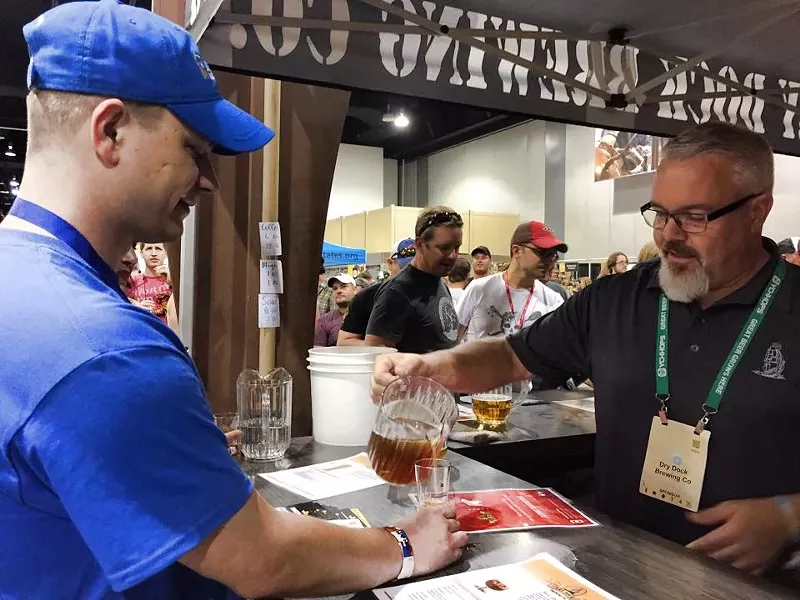 Image: Dry Dock Brewing co-founder Kevin DeLange pours beer at GABF in 2015.