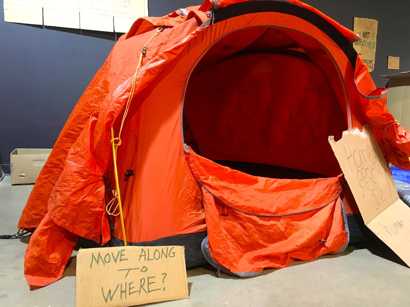 Friday's event at RedLine included an exhibit of signs and tents used by those experiencing homelessness.