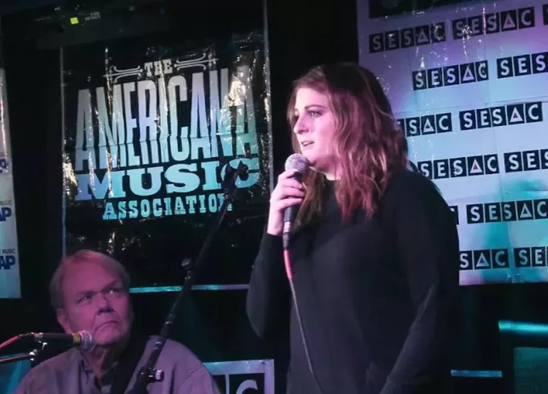Image: Meghan Trainor, whose 2014 hit, "All About That Bass," was certified diamond, speaks at a past Durango Songwriters Expo. Trainor met former NRBQ member Al Anderson, seated, at the expo, and he helped her get a record deal. Anderson will perform at this year's expo.