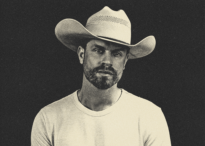 Image: man in a white cowboy hat