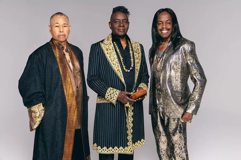 Image: three members of Earth, Wind & Fire