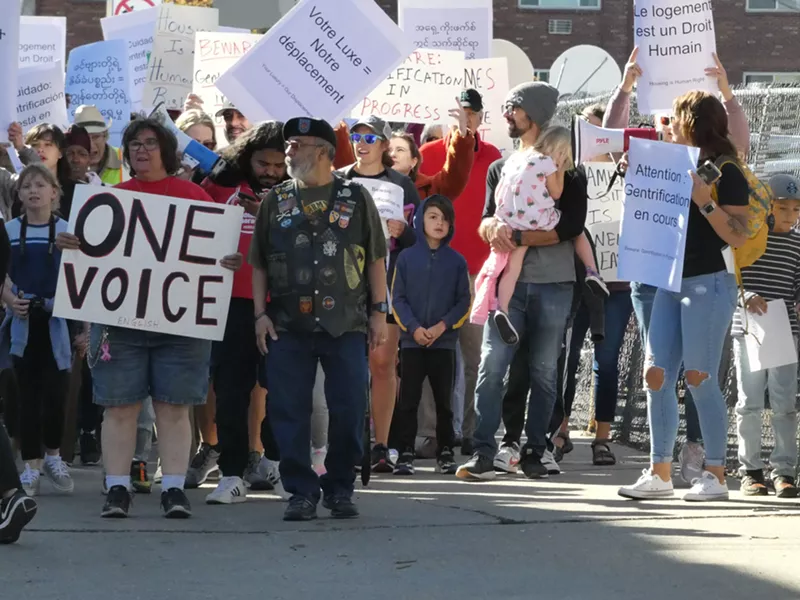 Image: Protestors march through an alleyway the morning of October 15.