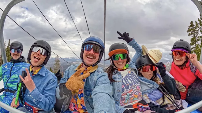 A group of six skiers in spring attire on a Breckenridge Ski Resort lift