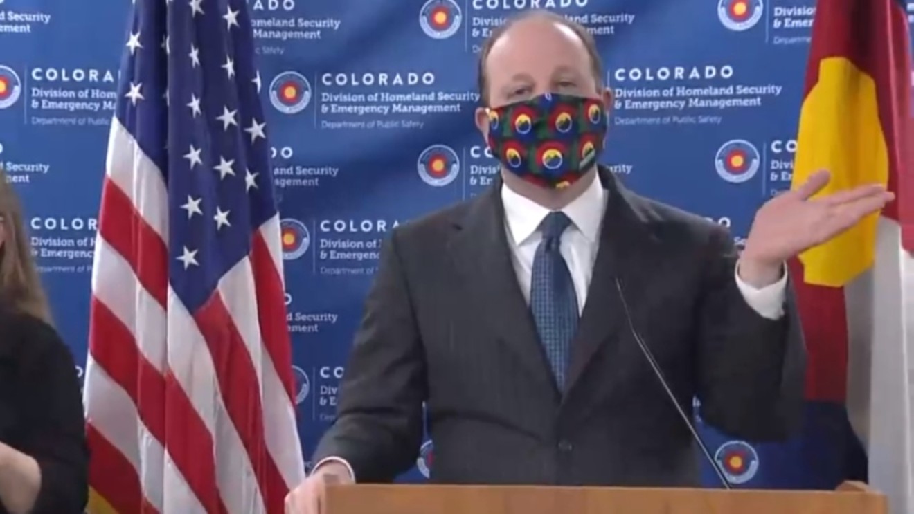 Governor Jared Polis during an April 3, 2020, press conference during which he modeled a cloth mask for the first time.