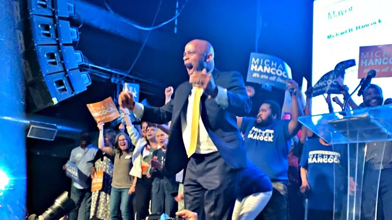 Image: Mayor Michael Hancock celebrating his victory at an election-night watch party.