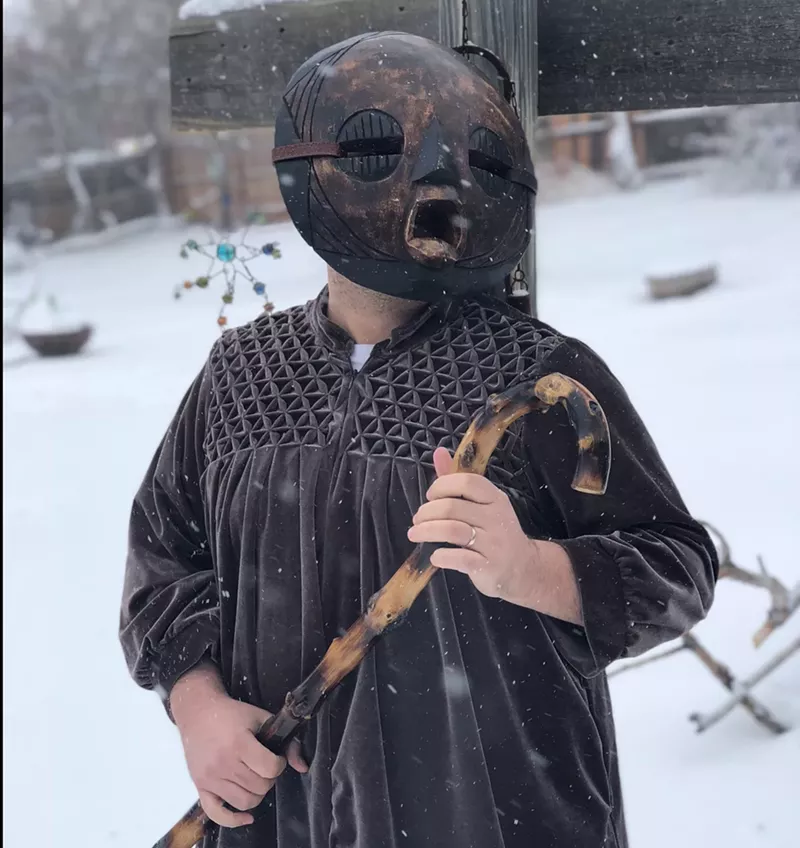 Image: Elk Minister holds his friend Gerald, a wooden stick.