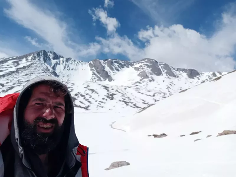 Image: Hiker Bryan Scarbeary takes a picture near the summit of Mount Evans after an 18-day hike starting in the city.