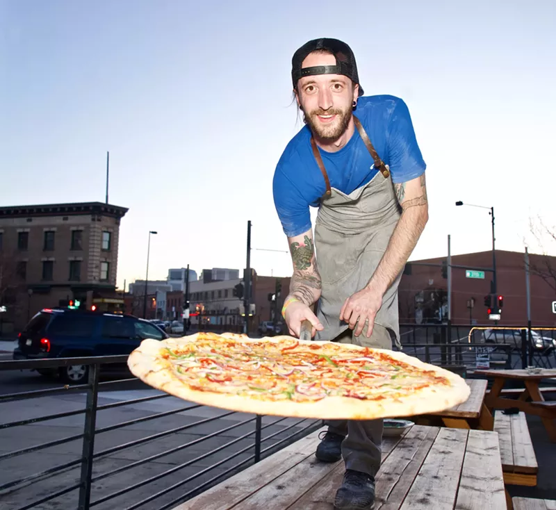 Image: Chef Mat Shumaker presents a New York-style pie at Famous Original J's.