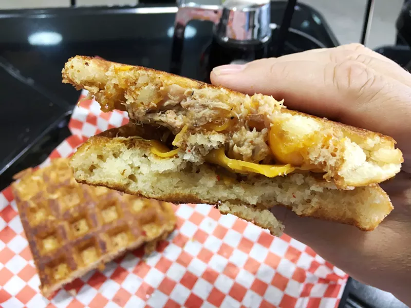 Image: A pullled-pork and cheddar waffle sandwich at the Waffle Place.