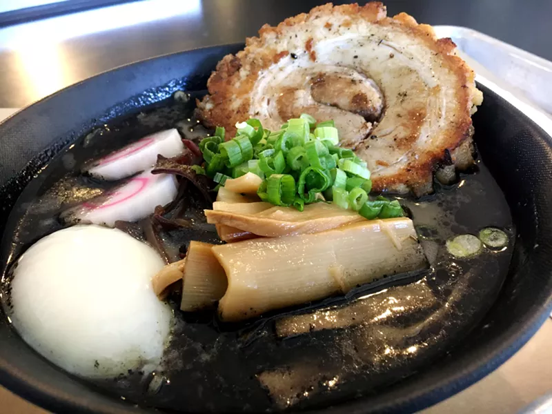 Image: Tora Ramen's black tonkotsu broth gets its color from squid ink and black garlic.