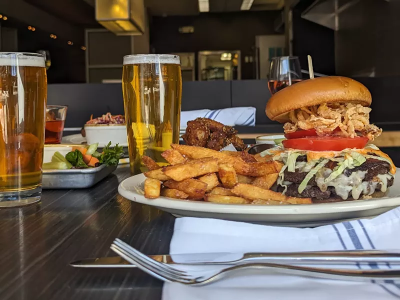 Image: a burger, fries and glass of beer
