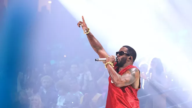 P Diddy performing in a red jersey