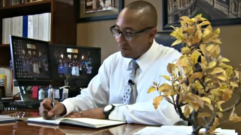 Image: Nick Dawkins in his office at Manual High School as seen in a laudatory 2015 Fox31 profile.