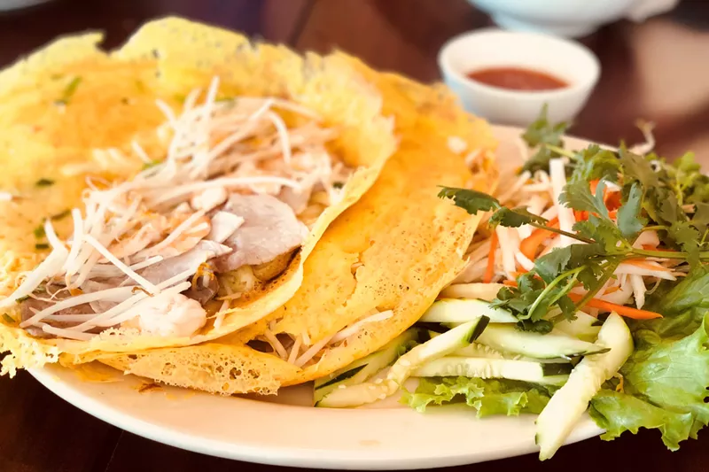 Image: Banh xeo is a light alternative to a steaming bowl of soup at Pho Vy.