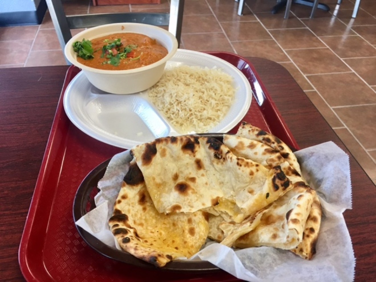 Butter chicken and housemade naan at Chutney, a new Indian restaurant on South Havana Street.