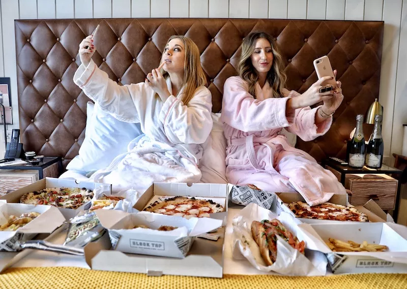 Image: Ashley Hesseltine and Rayna Greenberg of the Girls Gotta Eat podcast are rolling through both Comedy Works locations.