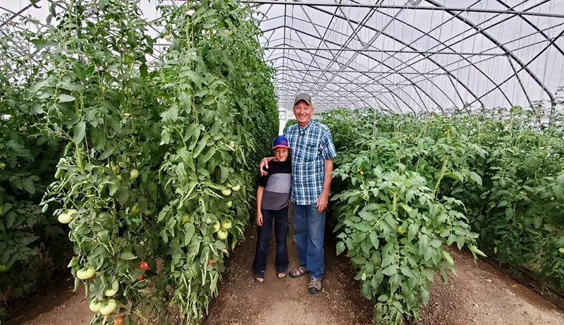 Image: Steve Cockroft and his son Andrew in a greenhouse on their farm.