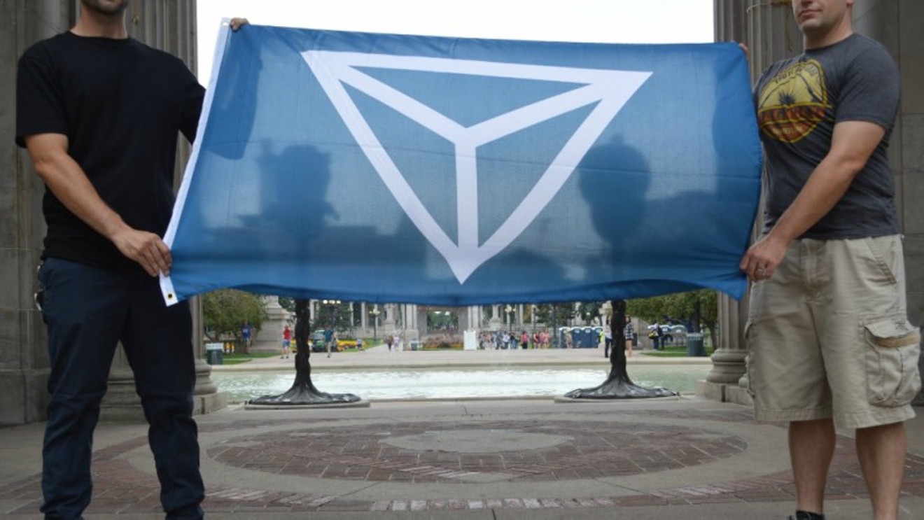 This photo of two men displaying the Identity Evropa flag at Denver's Civic Center Park was tweeted by the group last month.