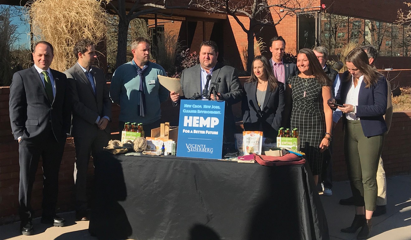 Vicente Sederberg's Mason Tvert (middle) gathered members of the Colorado General Assembly and hemp industry to celebrate industrial hemp's impending federal legalization.