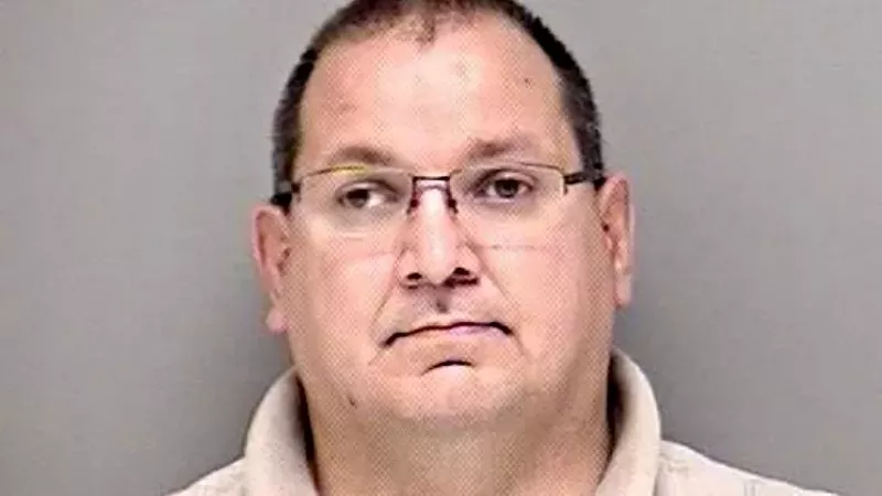 Image: The booking photo of former Westminster police officer Curtis Arganbright.