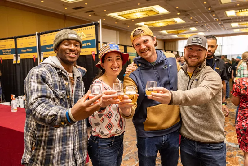 Image: Four people with beers.