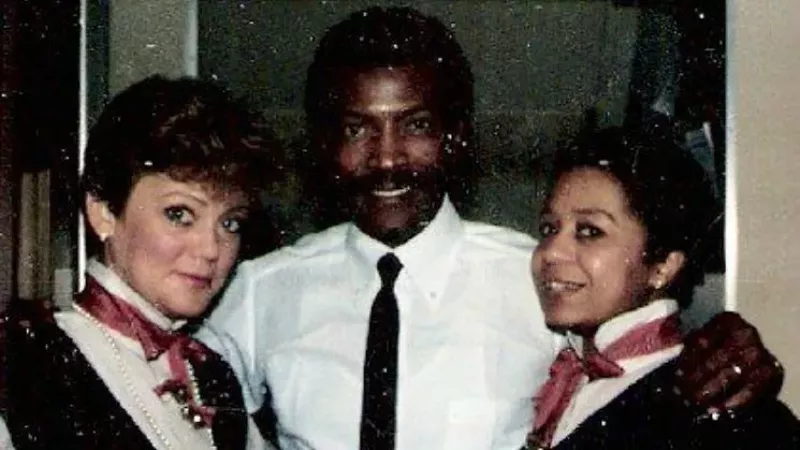 Image: Ruben Lee, center, with fellow flight attendants during an earlier part of his United Airlines career.