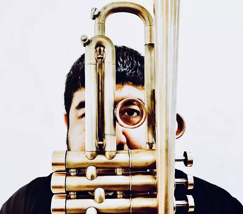 Image: Trumpeter Joshua Trinidad performs at Spangalang Brewery on Friday.