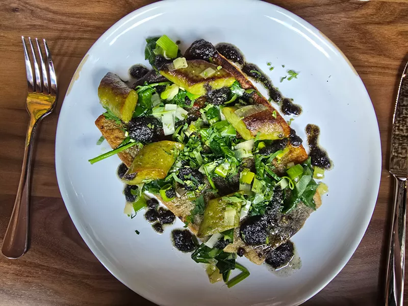 Image: trout with spinach gnudi on a plate