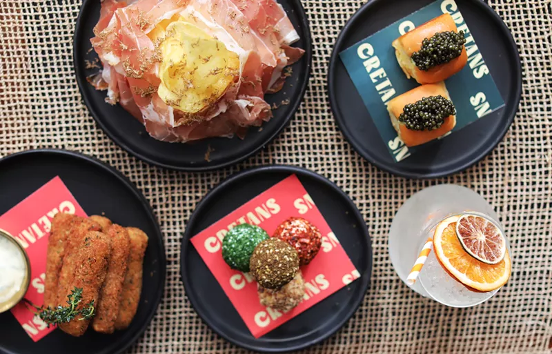 Image: Order an array of small plates at this Mediterranean wine bar.