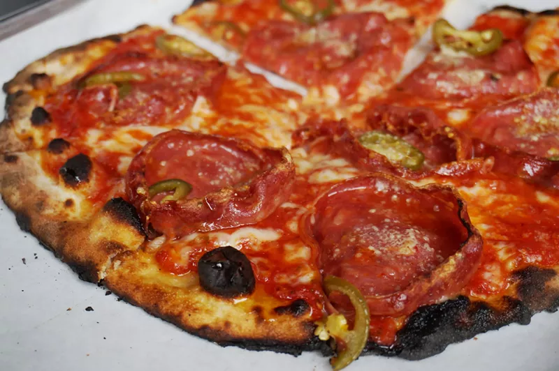 Image: The Porky Porkerino, with red sauce, mozzarella, sopressata, pickled jalapeños and spicy honey.