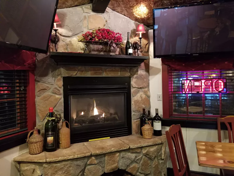 Image: Wine and a fireplace at Virgilio's — the perfect winter retreat.