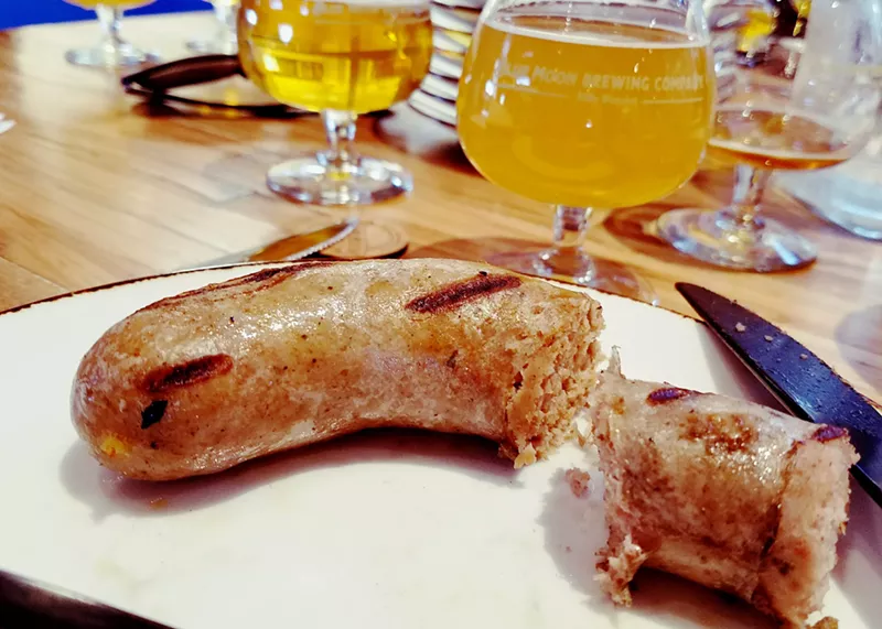Image: Sampling the soon-to-be-released beer brats by Brewed Food, Blue Moon and Tender Belly.