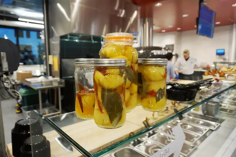 Image: TLV, inside Whole Foods Union Station, uses Mediterranean ingredients like preserved lemon for authentic Israeli street food.
