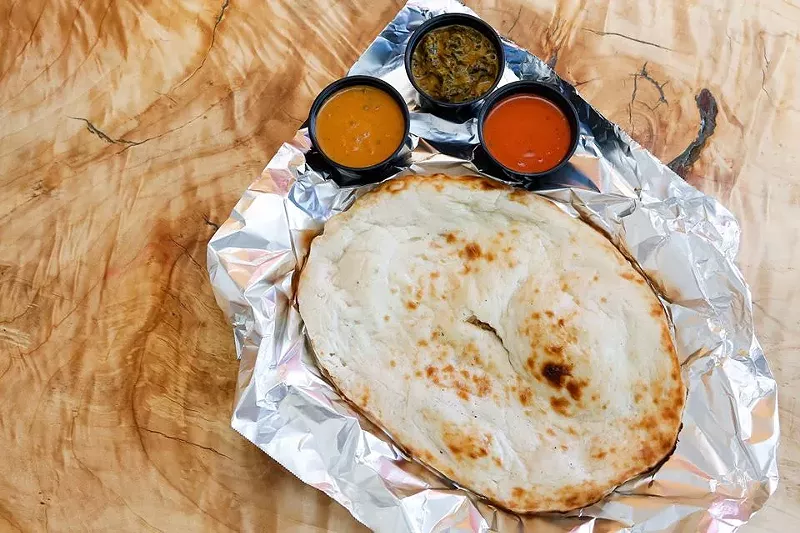 Image: There's always something for vegans at Bombay Clay Oven, like this housemade naan.