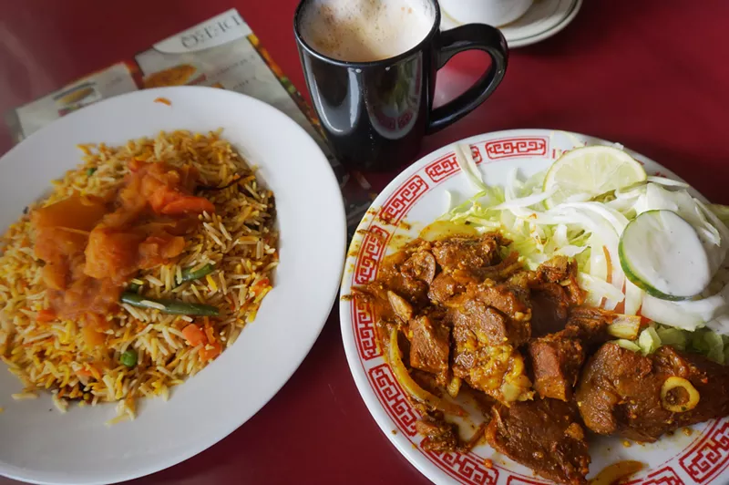 Image: Slow-cooked goat with seasoned rice and potatoes at Maandeeq.