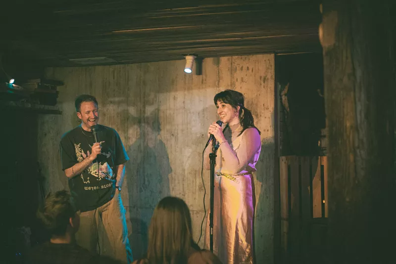 Image: standup comics performing in a room