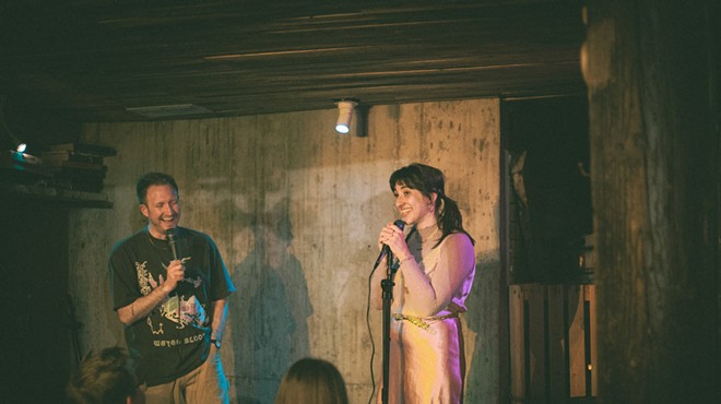 standup comics performing in a room