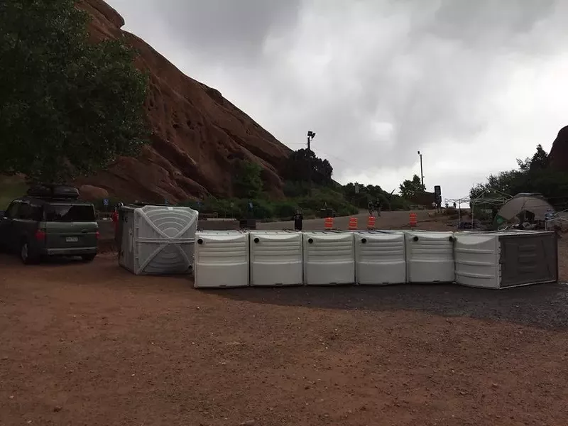 Image: These porta-potties tipped over after taking flight at Red Rocks.