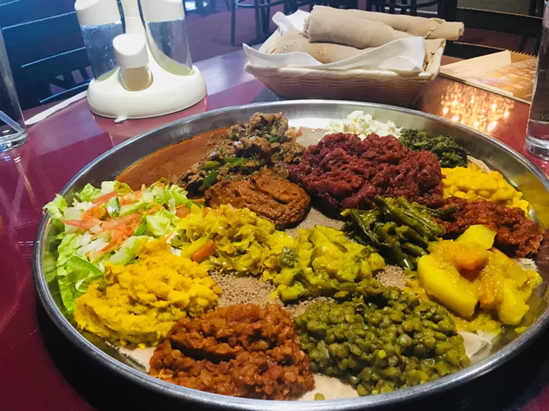 Image: A sampler platter of meat and vegetable dishes at the Nile.