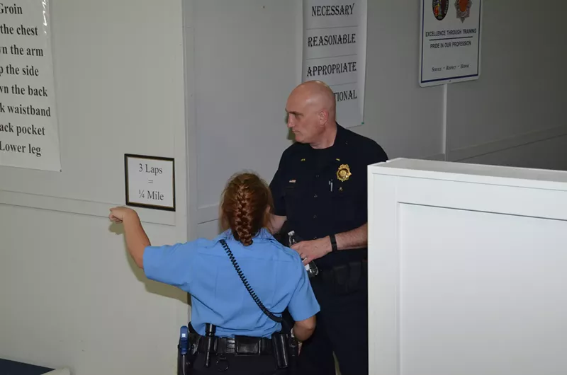 Image: Lieutenant John Coppedge with a police-department recruit.