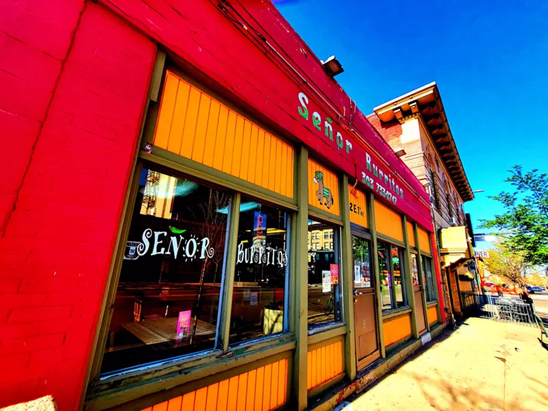 Image: front of building with a red awning