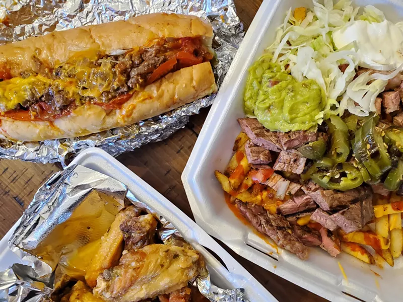 Image: wings, loaded nachos and a chopped cheese sandwich
