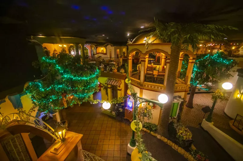 Image: interior of a restaurant made to look like a street in mexico