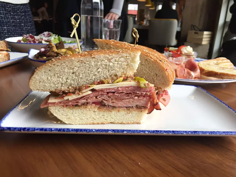 Image: The Emporium's muffaletta, for which chef Anderson says he's still perfecting the house-baked bread.