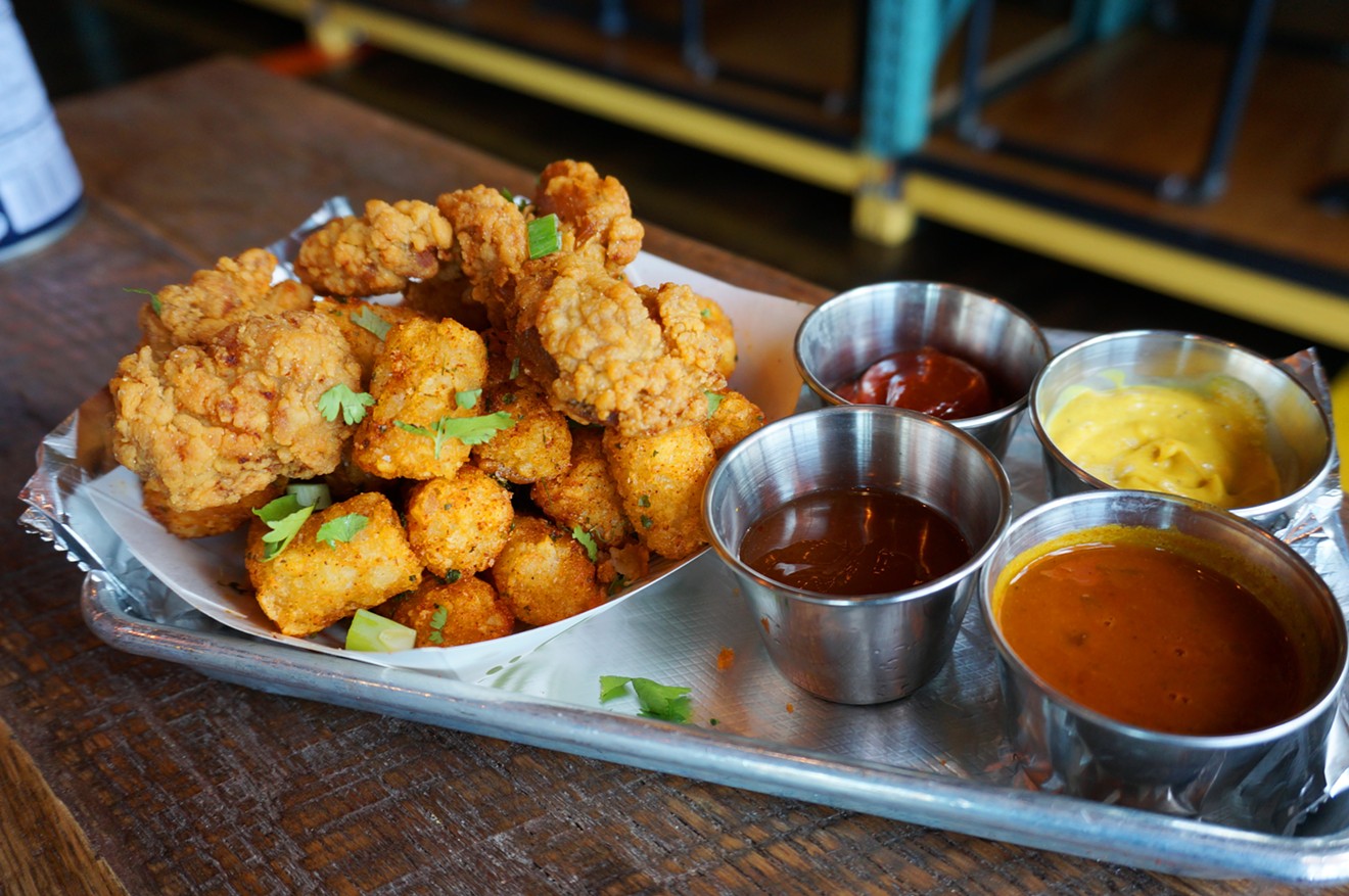 Kerala-style fried chicken with chile-lime tater tots and several sauces.