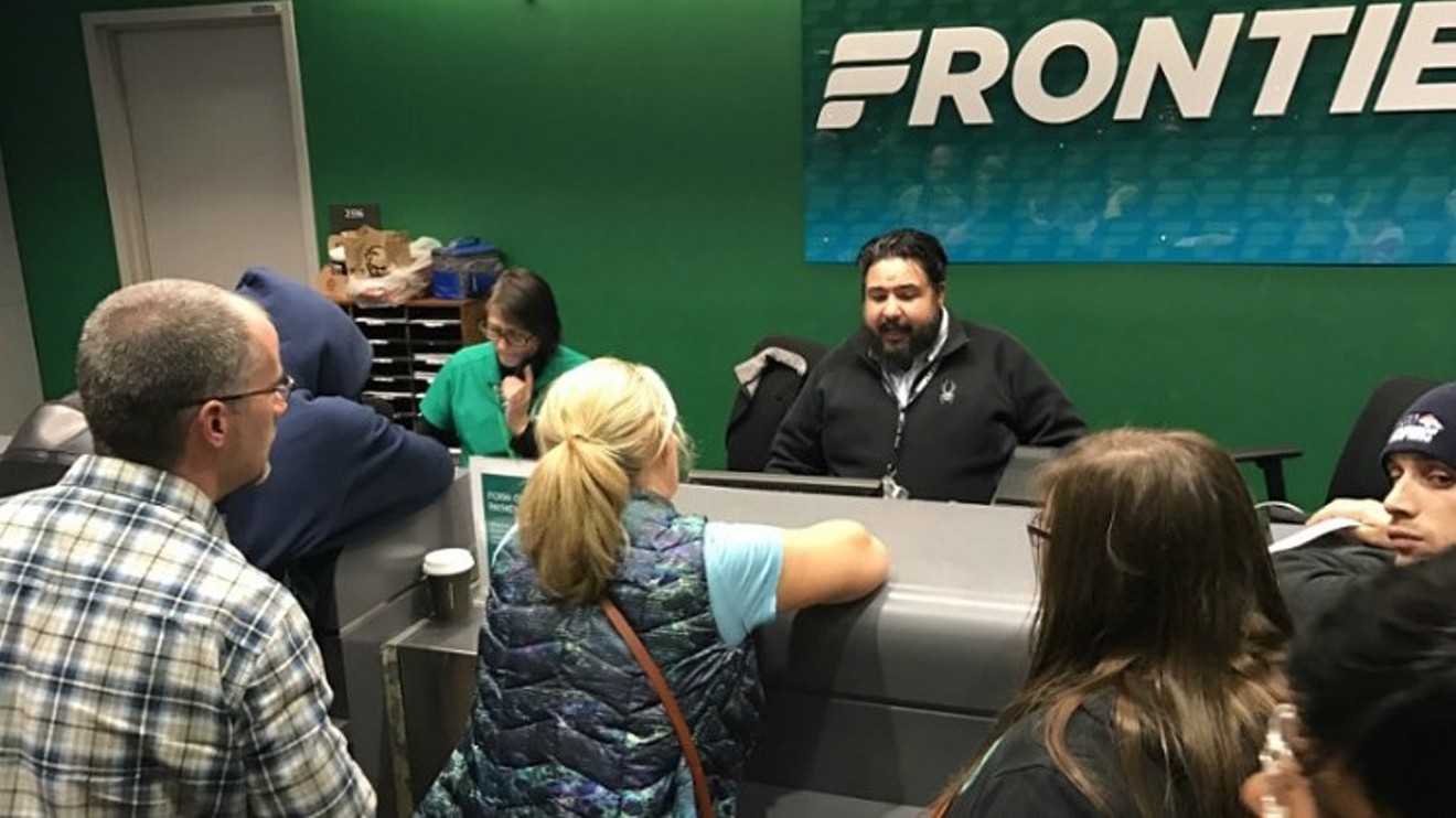 Irate passengers at a Frontier customer service counter circa December 2016.