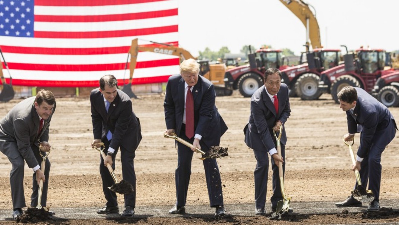 This June 2018 photo of Donald Trump at a Wisconsin groundbreaking should prepare you for how he'll look when he comes to Colorado to celebrate the start of wall construction.
