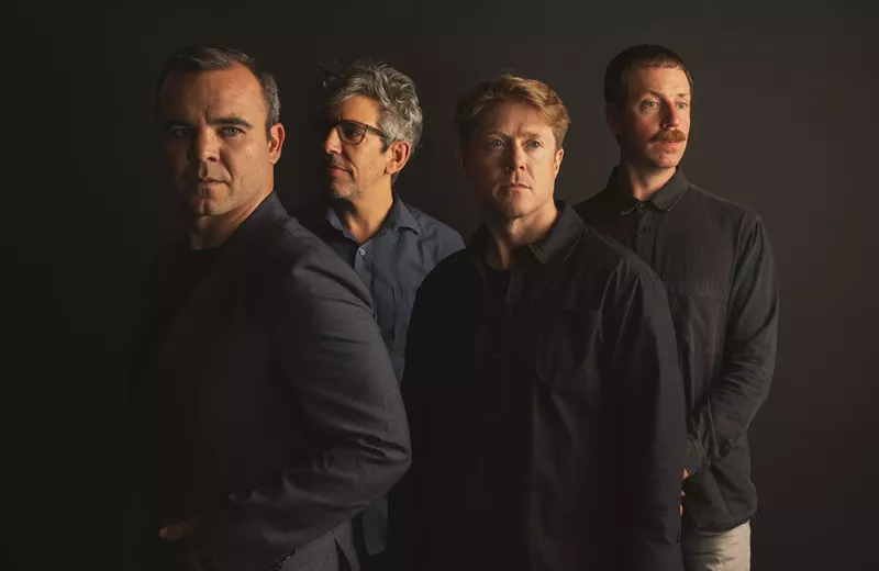 Image: four members of band
