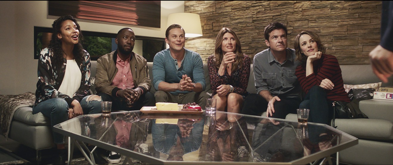 Jason Bateman (second from right) and Rachel McAdams (right) star as the perfect couple who play to win in Game Night, with a cast that includes (from left) Kylie Bunbury, Lamorne Morris, Billy Magnussen and Sharon Horgan.